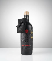Black bottle with a unique label on a white background