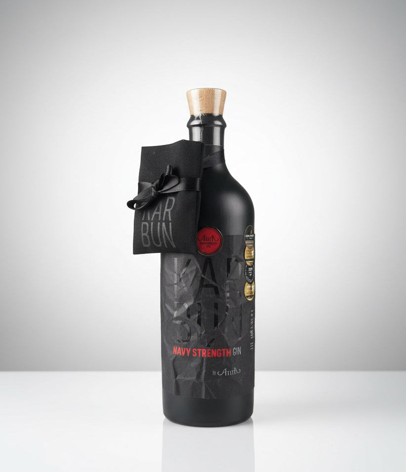 Black bottle with a unique label on a white background