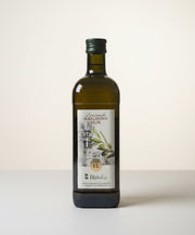 Bottle of olive oil with a label on a white background