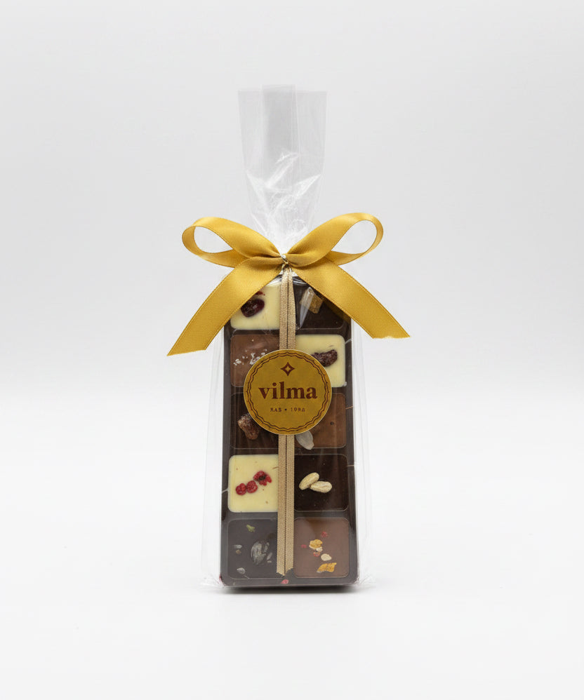 Packaged chocolate assortment with a yellow ribbon on a white background