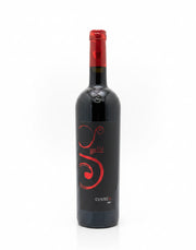 Wine bottle with red label on a white background