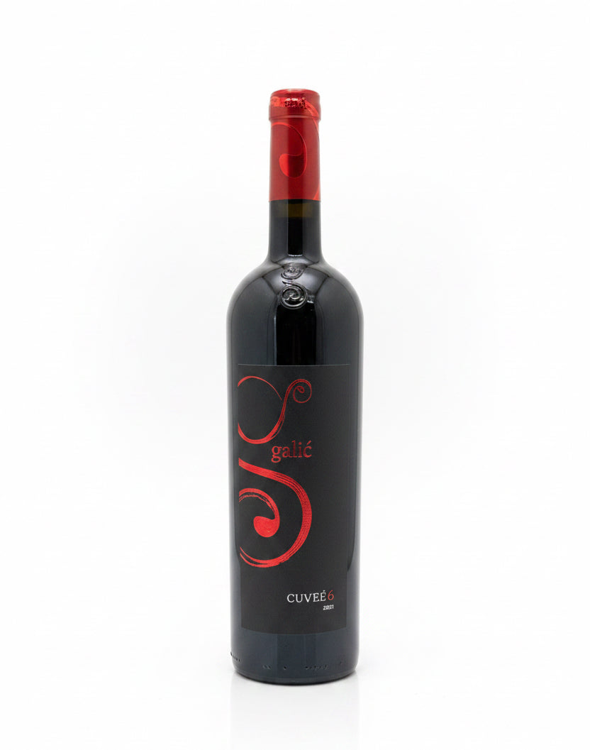 Wine bottle with red label on a white background