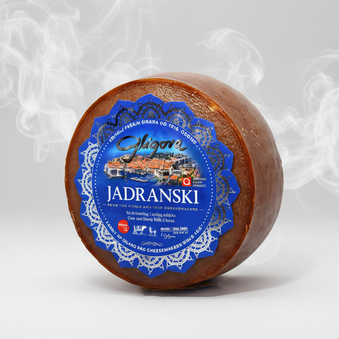 Round cheese wheel with a blue label on a white background