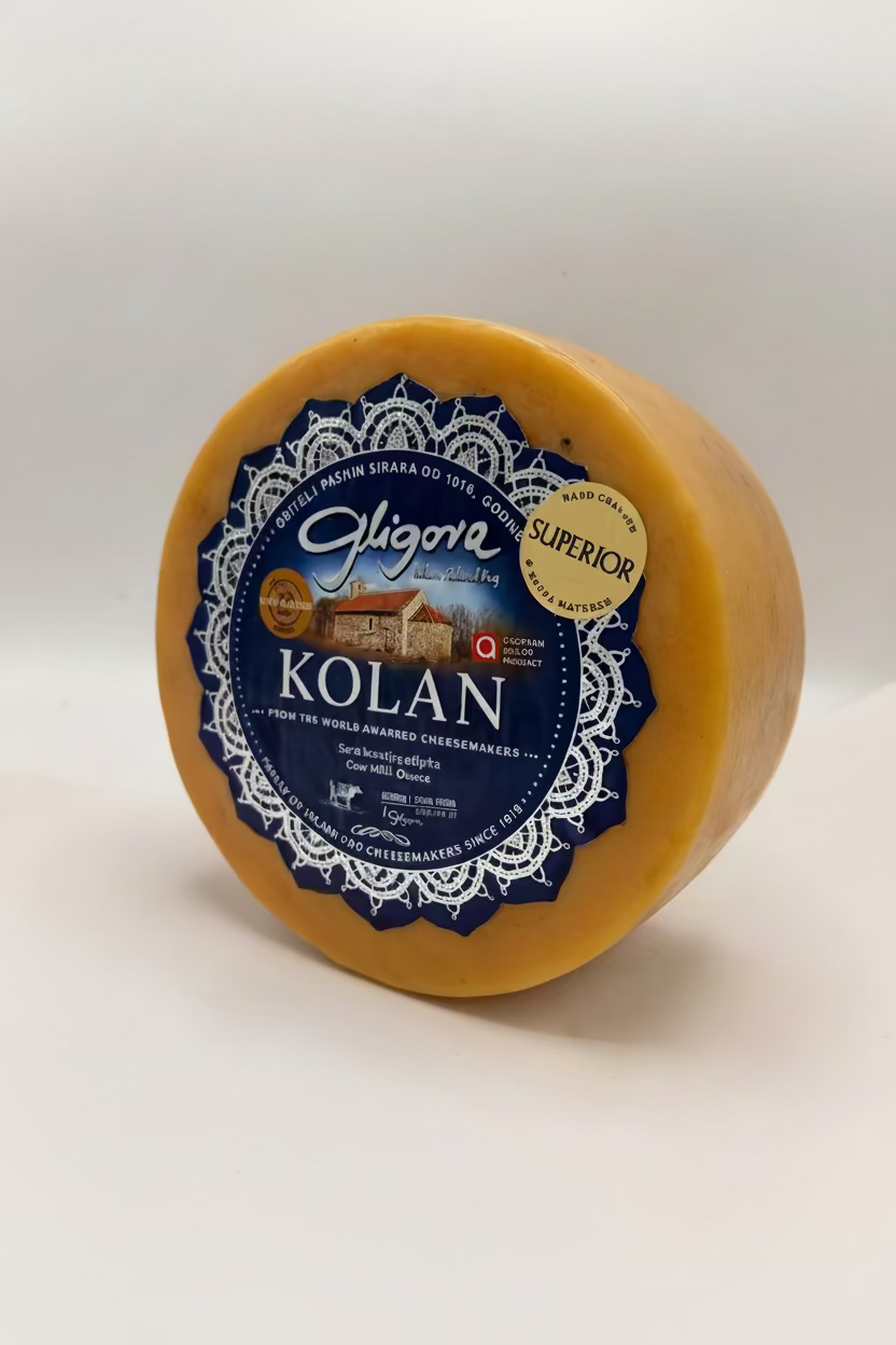 Round cheese wheel with 'Gligora Kolan' label on a white background