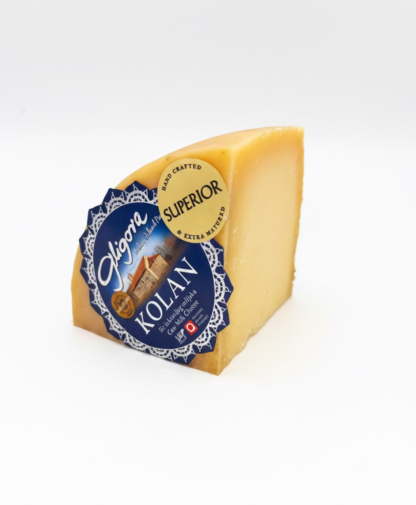 Triangle of cheese with a blue and yellow label on a white background