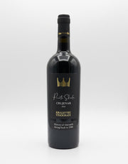 Black wine bottle with gold accents on a white background