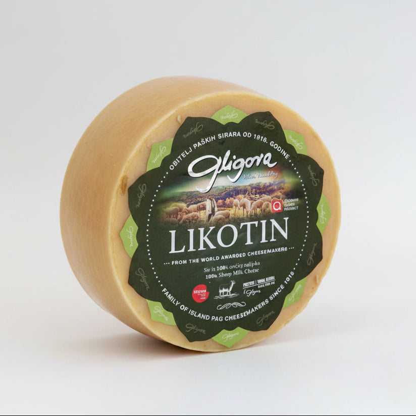 Round cheese with a green label on a white background