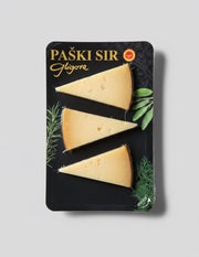 Paski Sir Gigore cheese packaging with three triangular pieces on a black background.