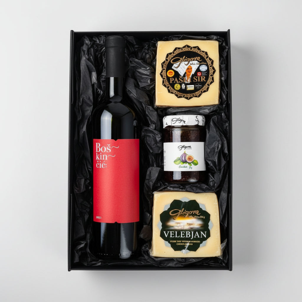 Gift set with a bottle of Boskinac wine, cheese, and other items in a black box.