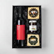 Gift set with a bottle of Boskinac wine, cheese, and other items in a black box.