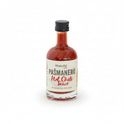 Bottle of Matulic Pasmanero Hot Chili Sauce on a white background