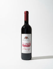 Red wine bottle with a label on a white background