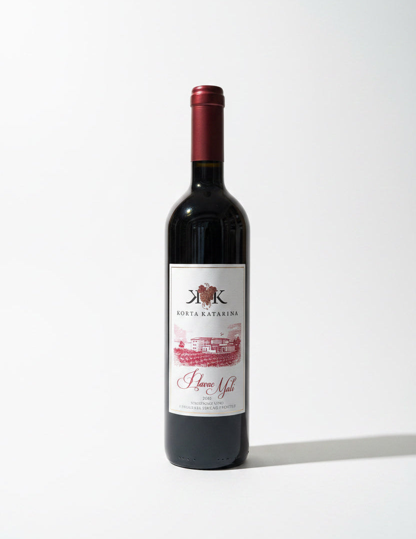 Red wine bottle with a label on a white background