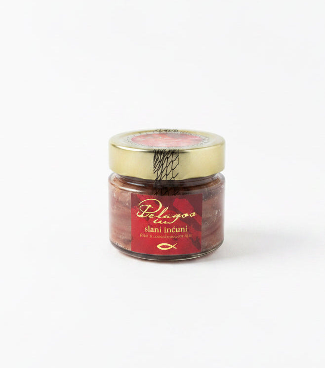 Jar of Pelagos sun dried anchovies on a white background