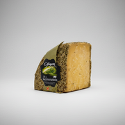 Block of cheese with a label on a white background