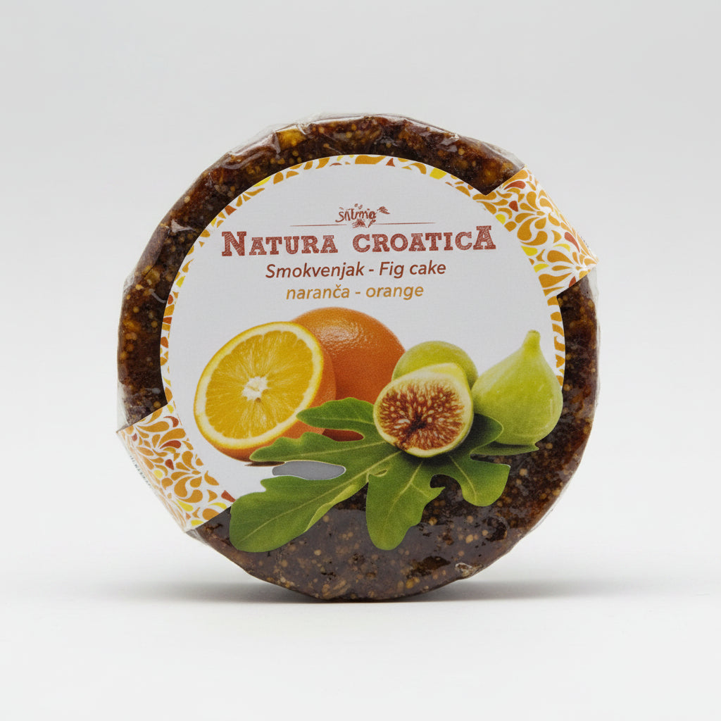 Round cake with orange and fig design on packaging against a white background