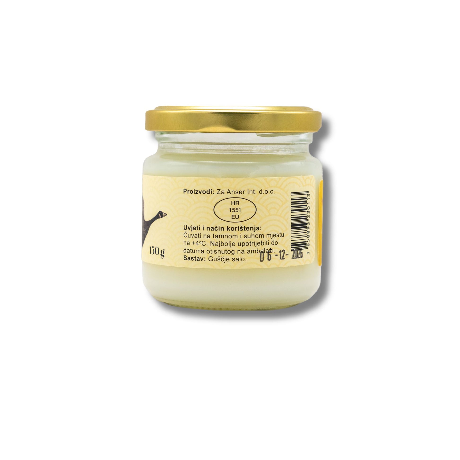 Jar of cream with a gold lid on a white background