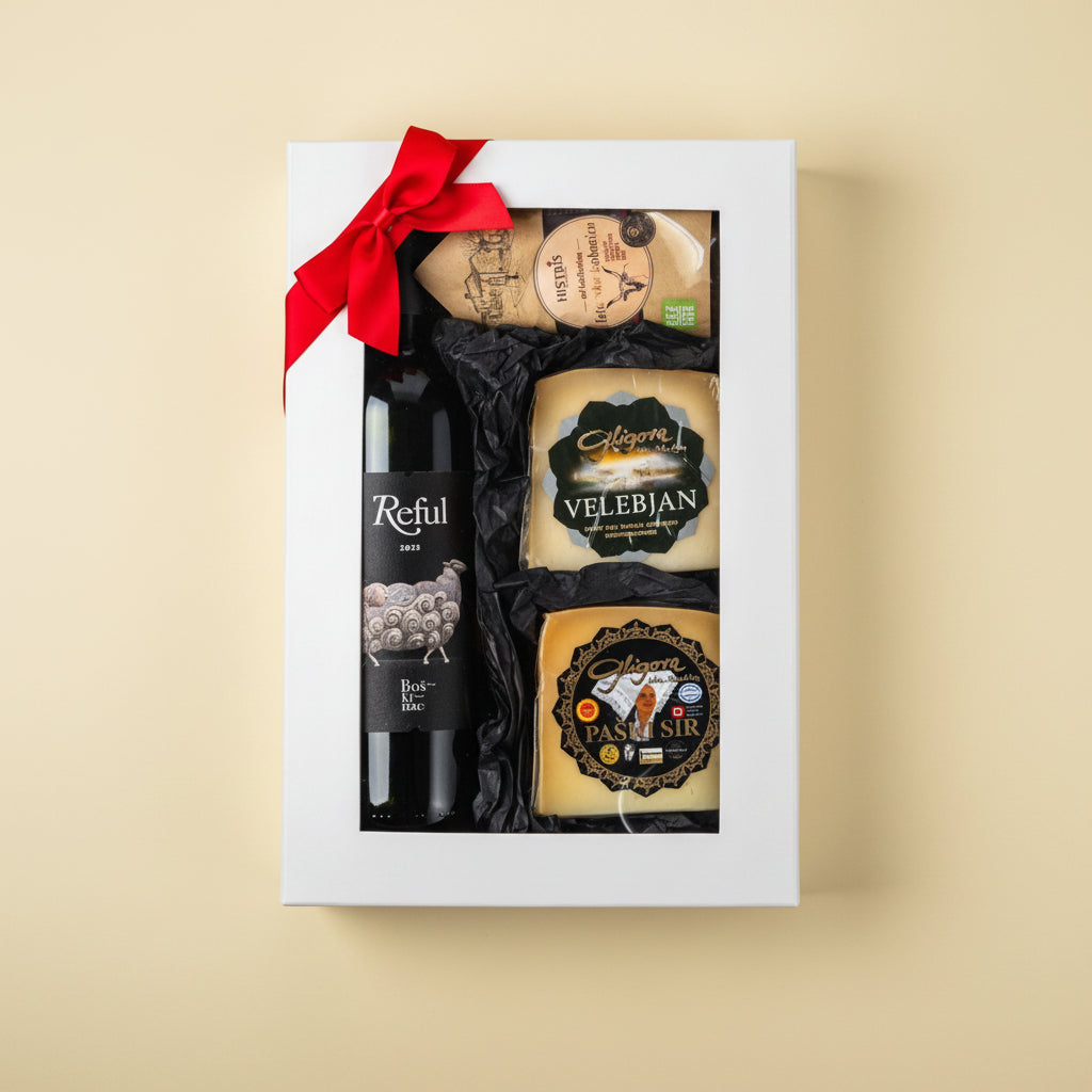 Bura premium gourmet gift box by Gligora featuring Pag cheese, Velebjan cheese, cured Histris Boškarin sausage, and a bottle of Boškinac Reful premium red wine inside an elegant black magnetic box.