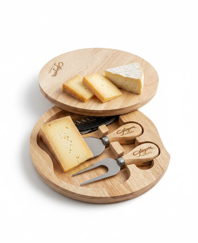 Wooden cheese board set with cheese and tools on a white background