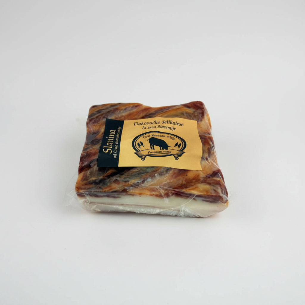 Packaged pork ham with a label on a white background
