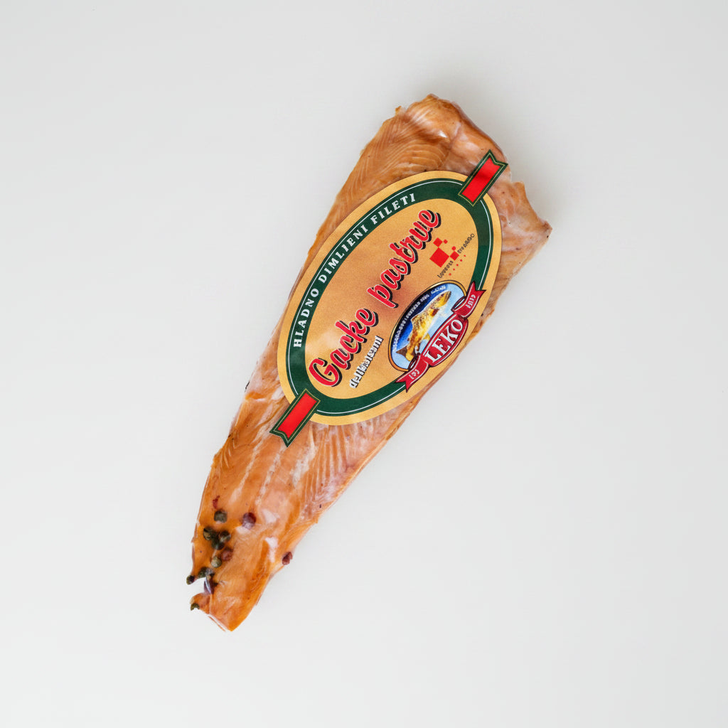 Packaged salmon fillet with a label on a white background