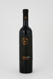 Black wine bottle with a visible label on a white background