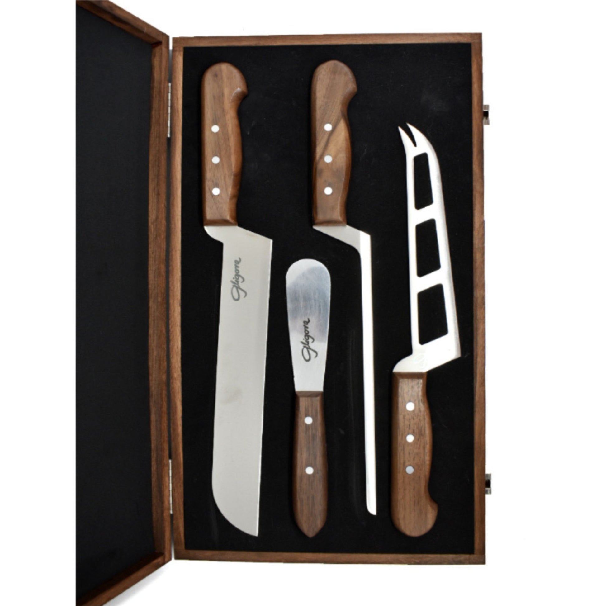 Set of four knives with wooden handles in a wooden box on a white background