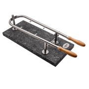 Cheesecutter with wooden handles on a dark stone base against a black background