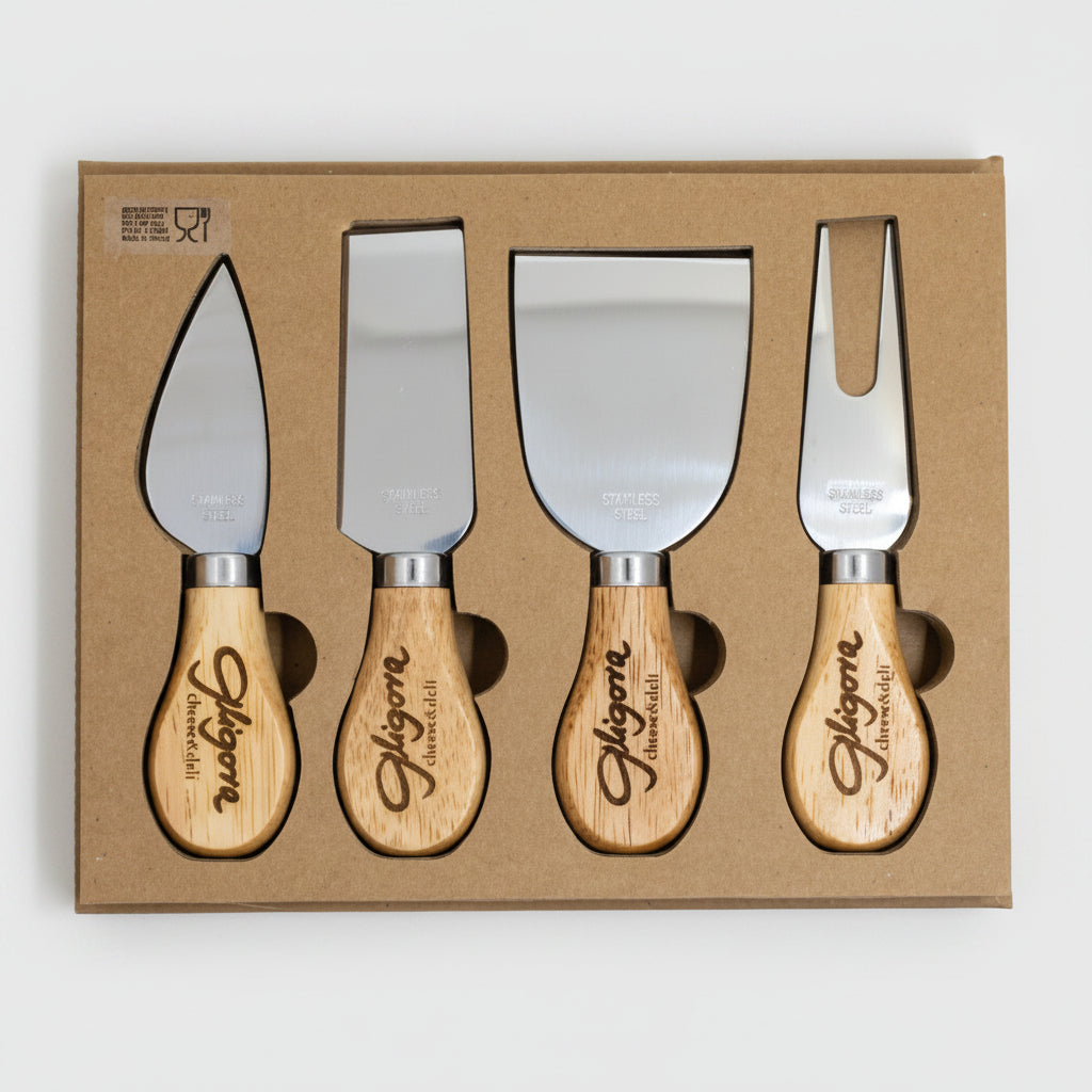 Set of four cheese knives with wooden handles in a cardboard box