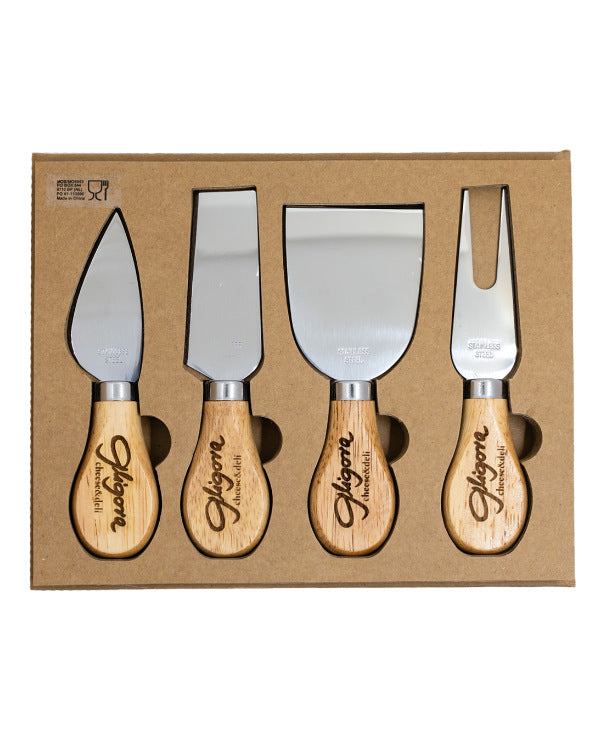 Set of four cheese knives with wooden handles in a cardboard box