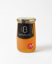 Jar of honey with a Bartolovié label on a white background