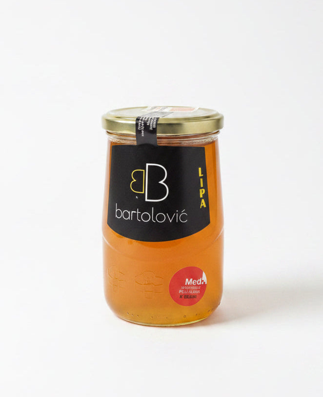 Jar of honey with a Bartolovié label on a white background