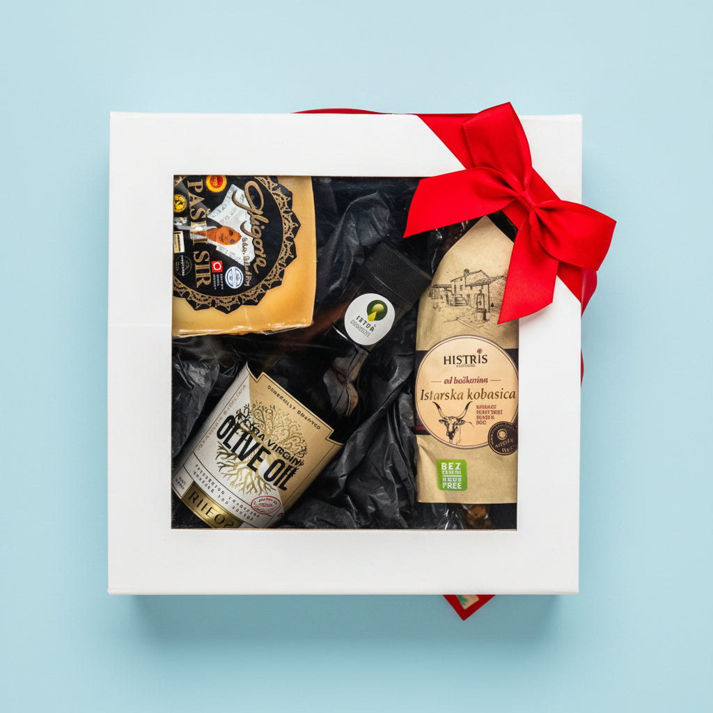 More Mediterranean gourmet gift box by Gligora showcasing award-winning Pag cheese (Paški sir), premium Rheos extra virgin olive oil from Istria, and authentic cured Histris Boškarin sausage inside a compact black magnetic box.