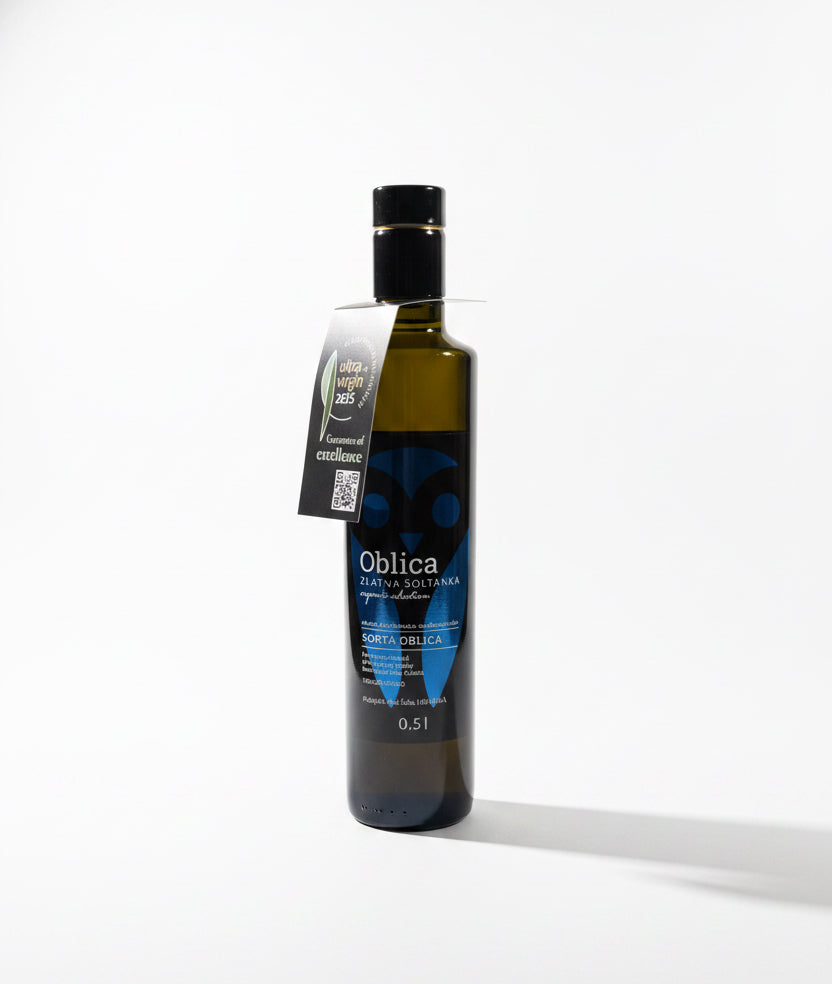 Bottle of Oblica olive oil on a wooden surface