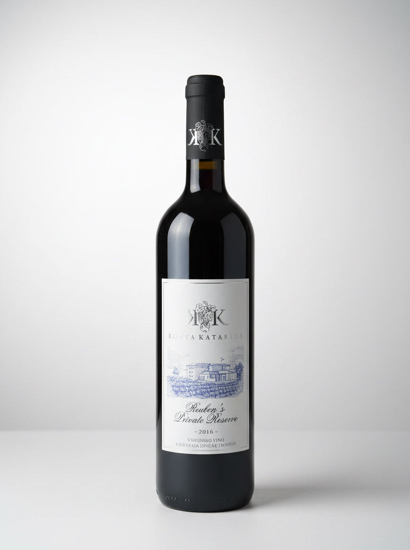 Red wine bottle with a label on a white background