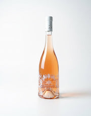 Bottle of rosé wine with a white label on a light gray background