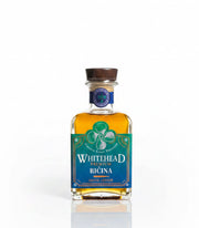 Bottle of Whitehead Premium Ricina liquor on a white background