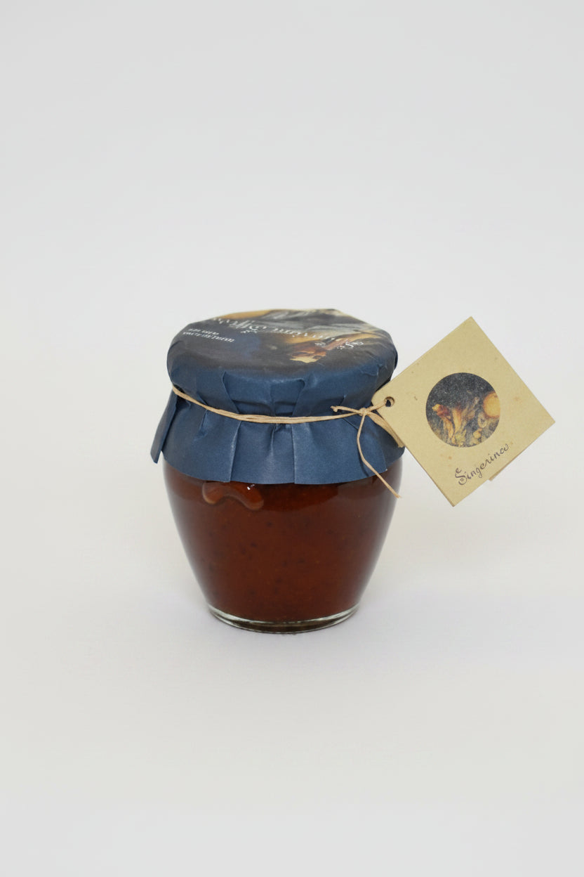 Jar of jam with a blue lid and tag on a white background