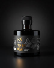 Bottle of Vinski Oca with a dark label on a black background