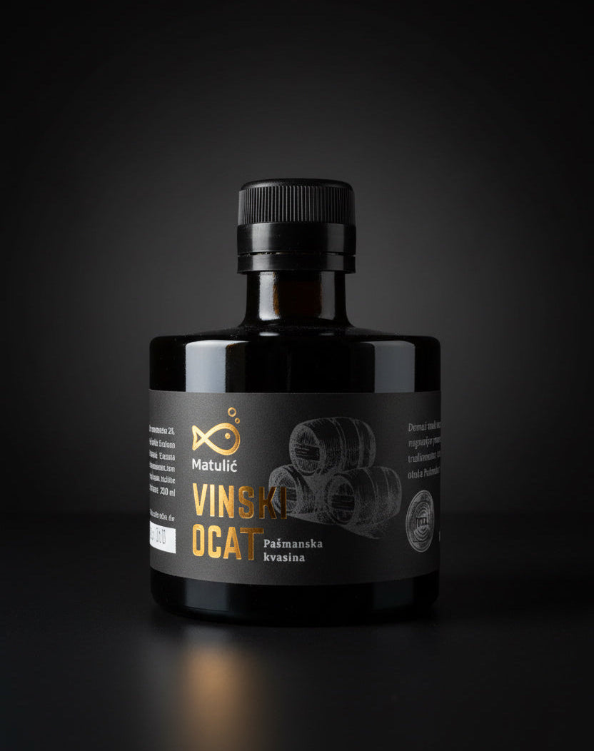 Bottle of Vinski Oca with a dark label on a black background